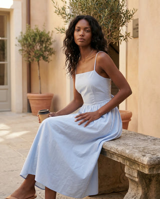 Stella Wedding Guest Spaghetti Strap Midi Dress in Light Blue — lifestyle seated view