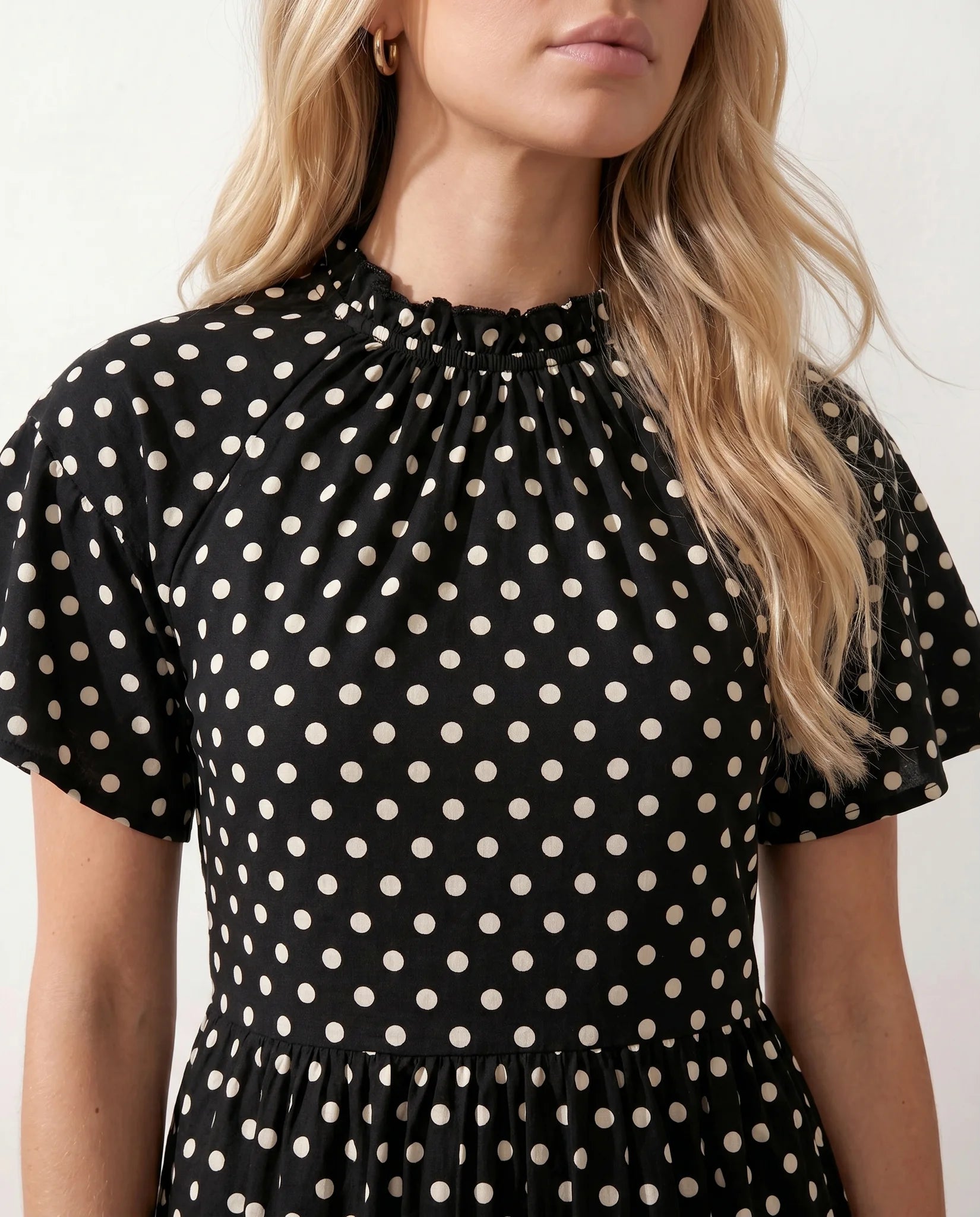 Romy Polka Dot Ruffle Detail Mini Dress in Dots Black — detail close-up