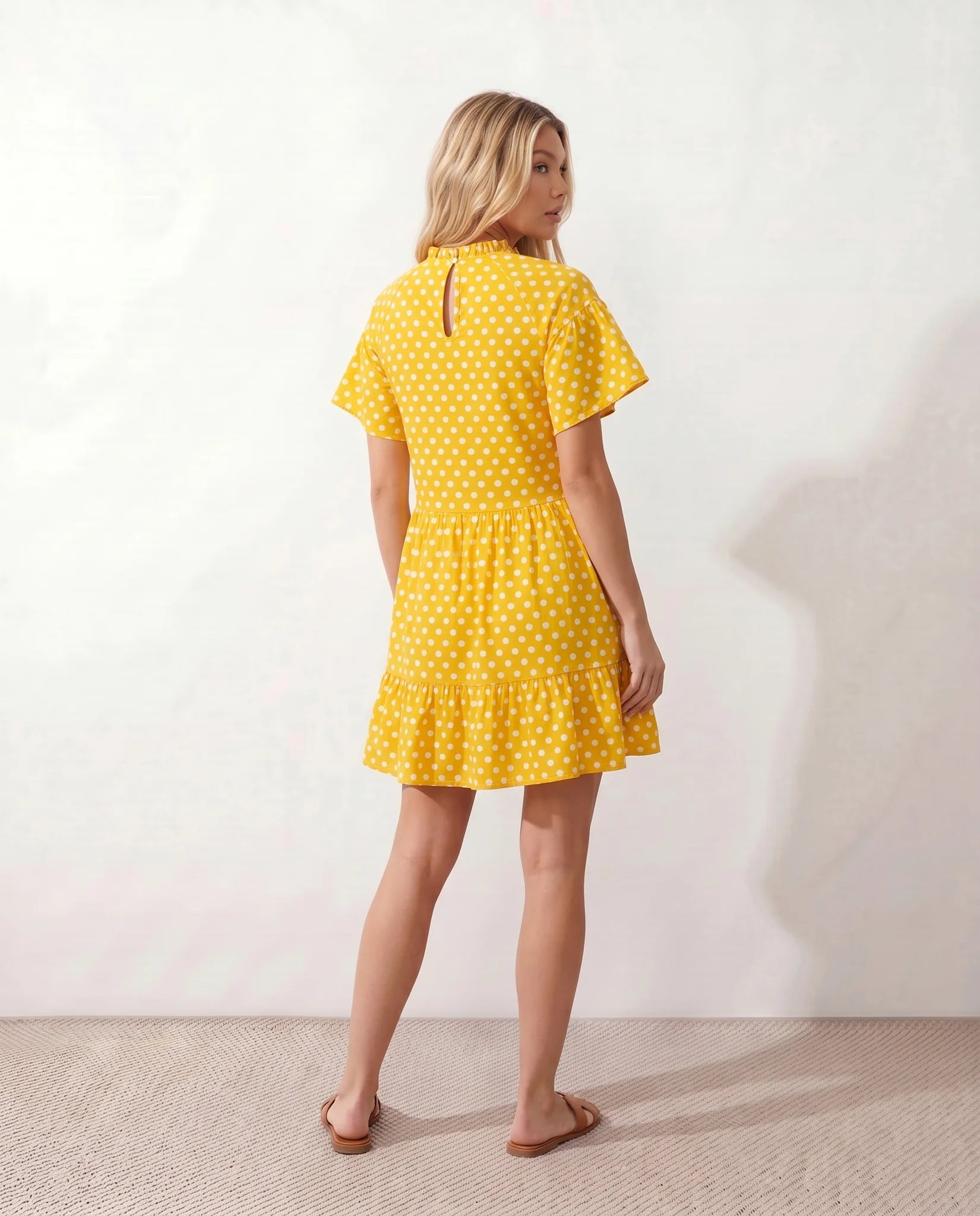 Romy Polka Dot Ruffle Detail Mini Dress in Dots Yellow — back view