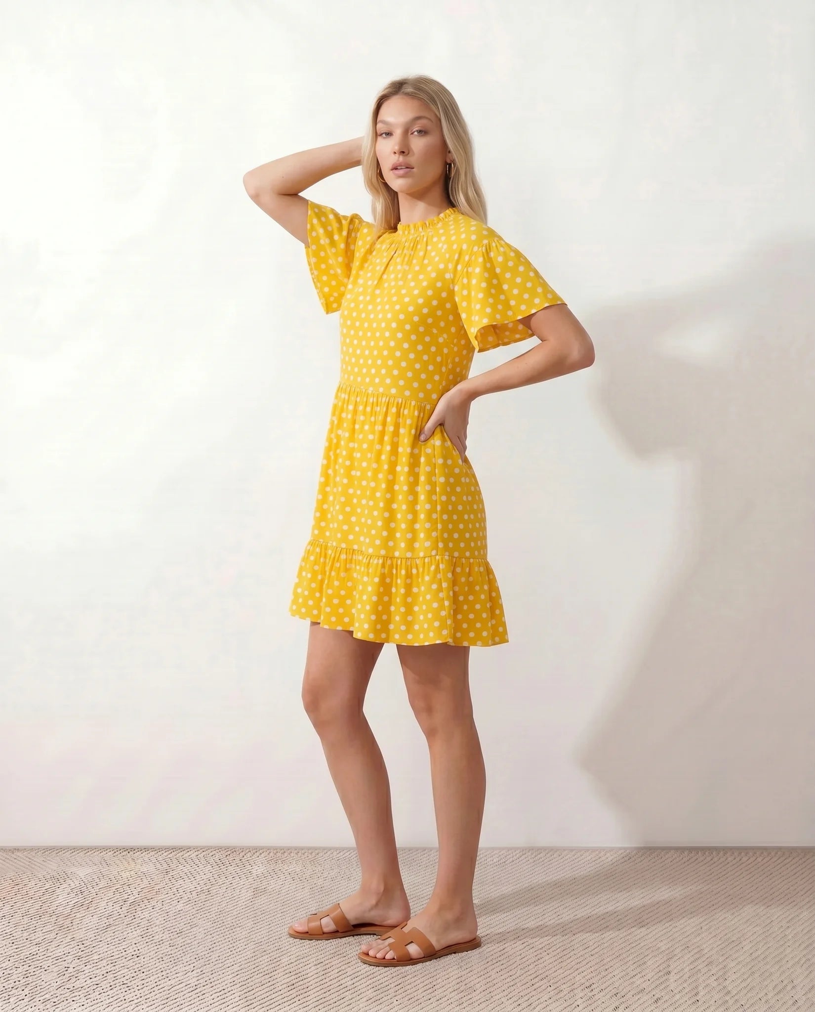 Romy Polka Dot Ruffle Detail Mini Dress in Dots Yellow — side view