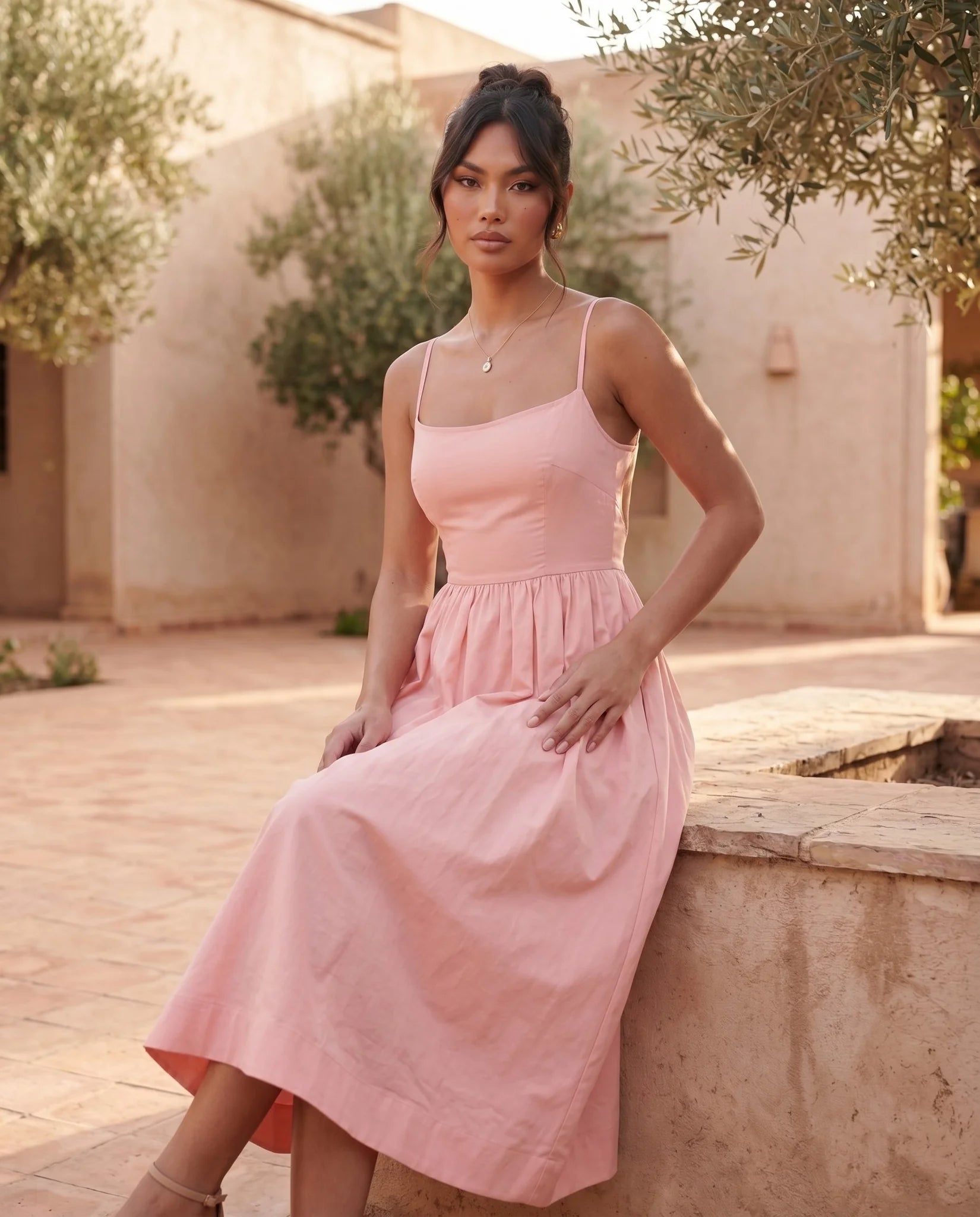 Layla Wedding Guest Spaghetti Strap Midi Dress in Pink — lifestyle seated view