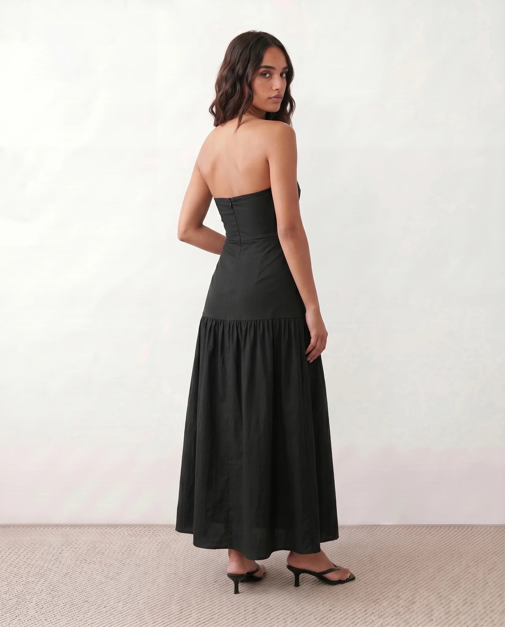 Lyra Cocktail Strapless Maxi Dress in Black — back view