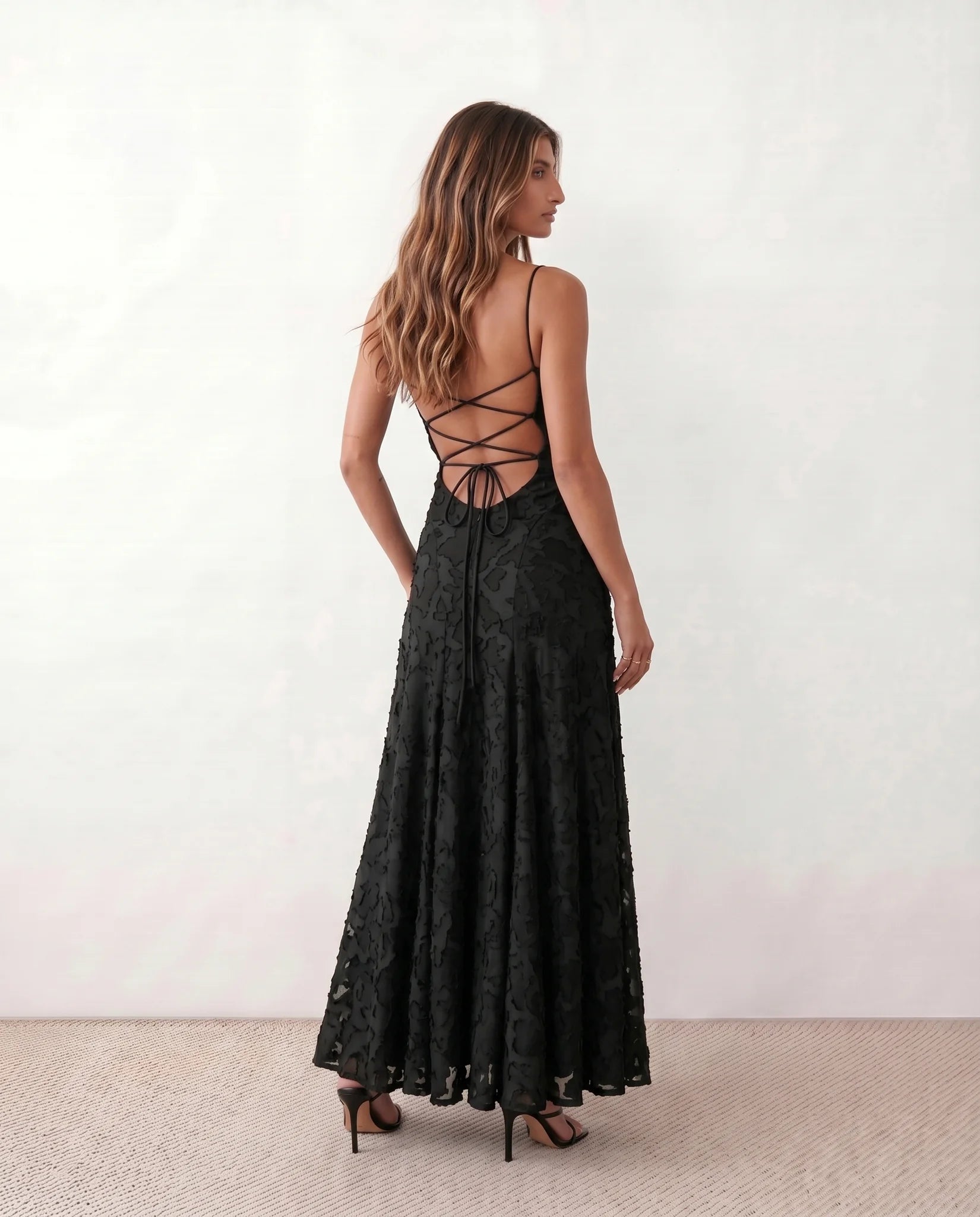 Dahlia Wedding Guest Spaghetti Strap Maxi Dress in Black — back view