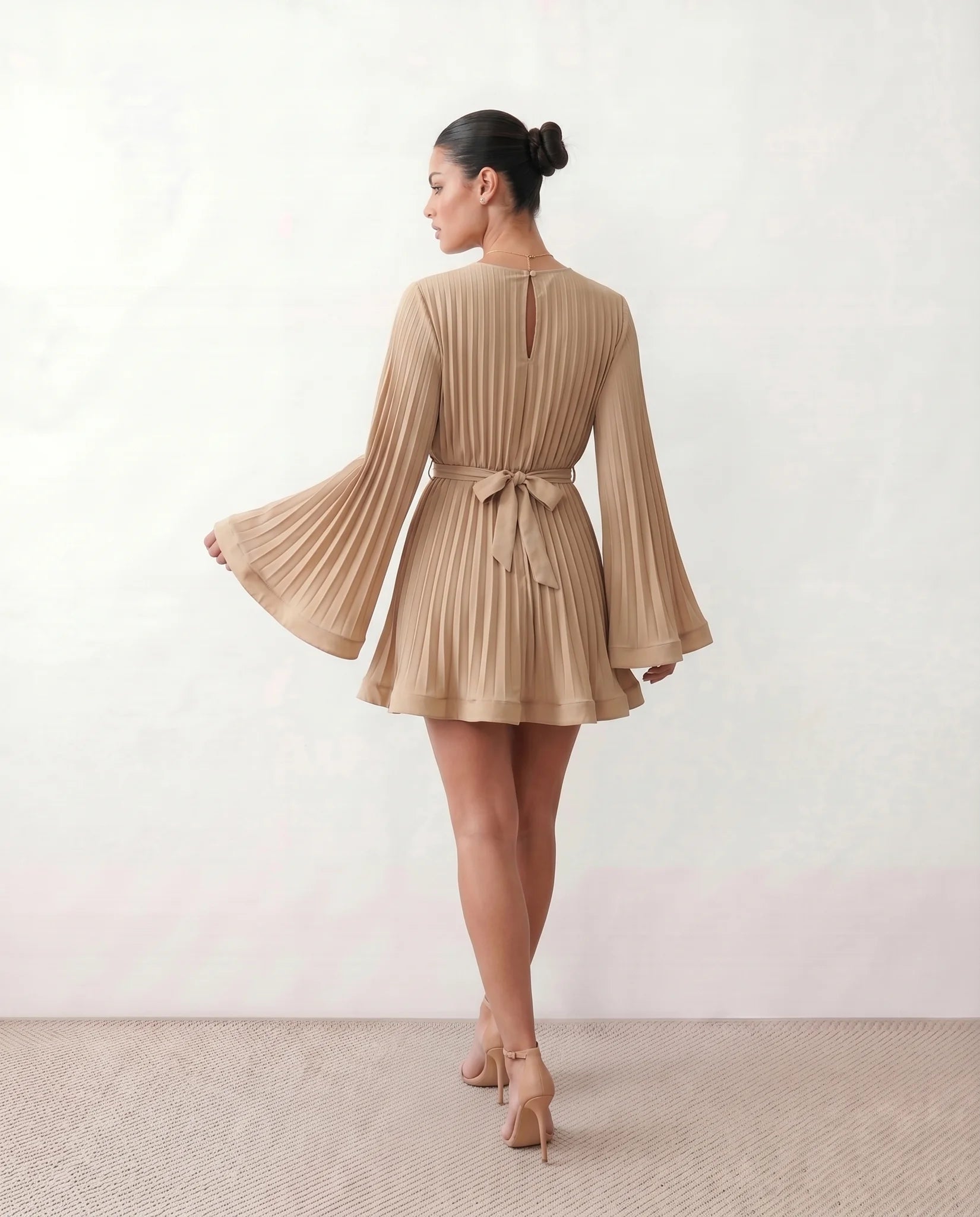 Caroline Cocktail Pleated Mini Dress in Beige — back view