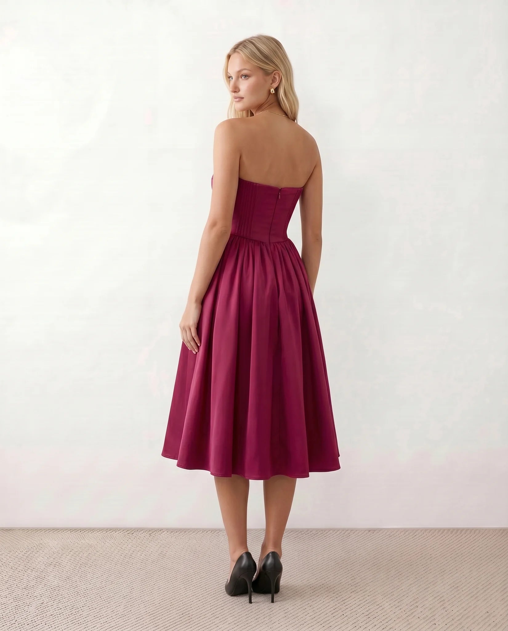Vicenta Basque Waist Strapless Midi Dress in Burgundy — back view