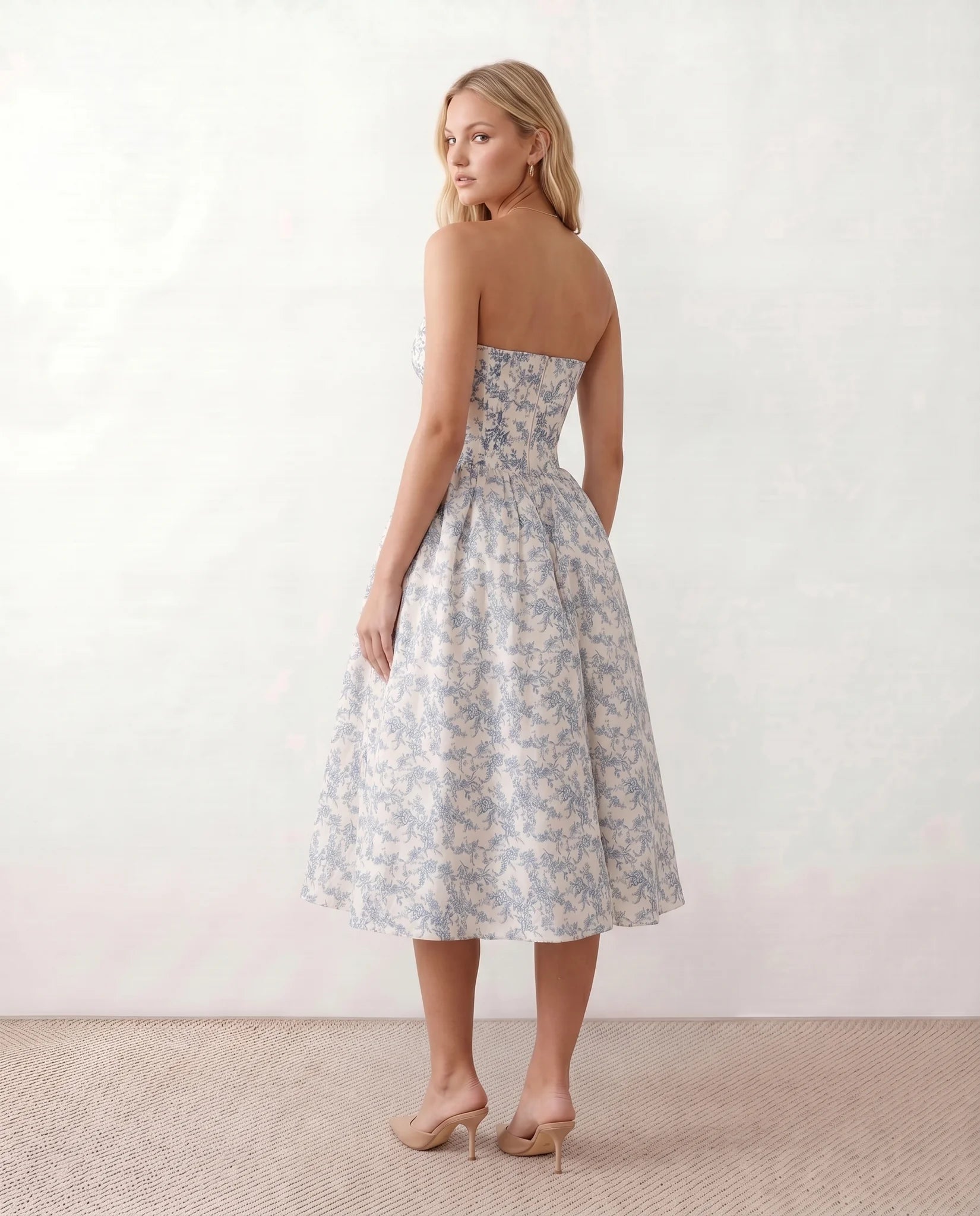 Vicenta Basque Waist Strapless Midi Dress in Floral Blue — back view