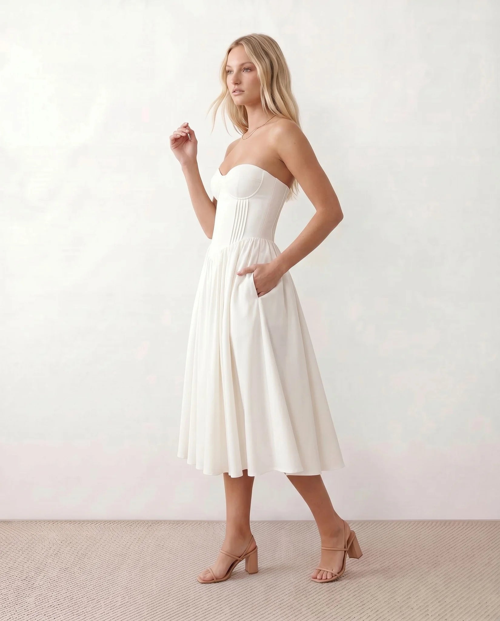 Vicenta Basque Waist Strapless Midi Dress in White — side view