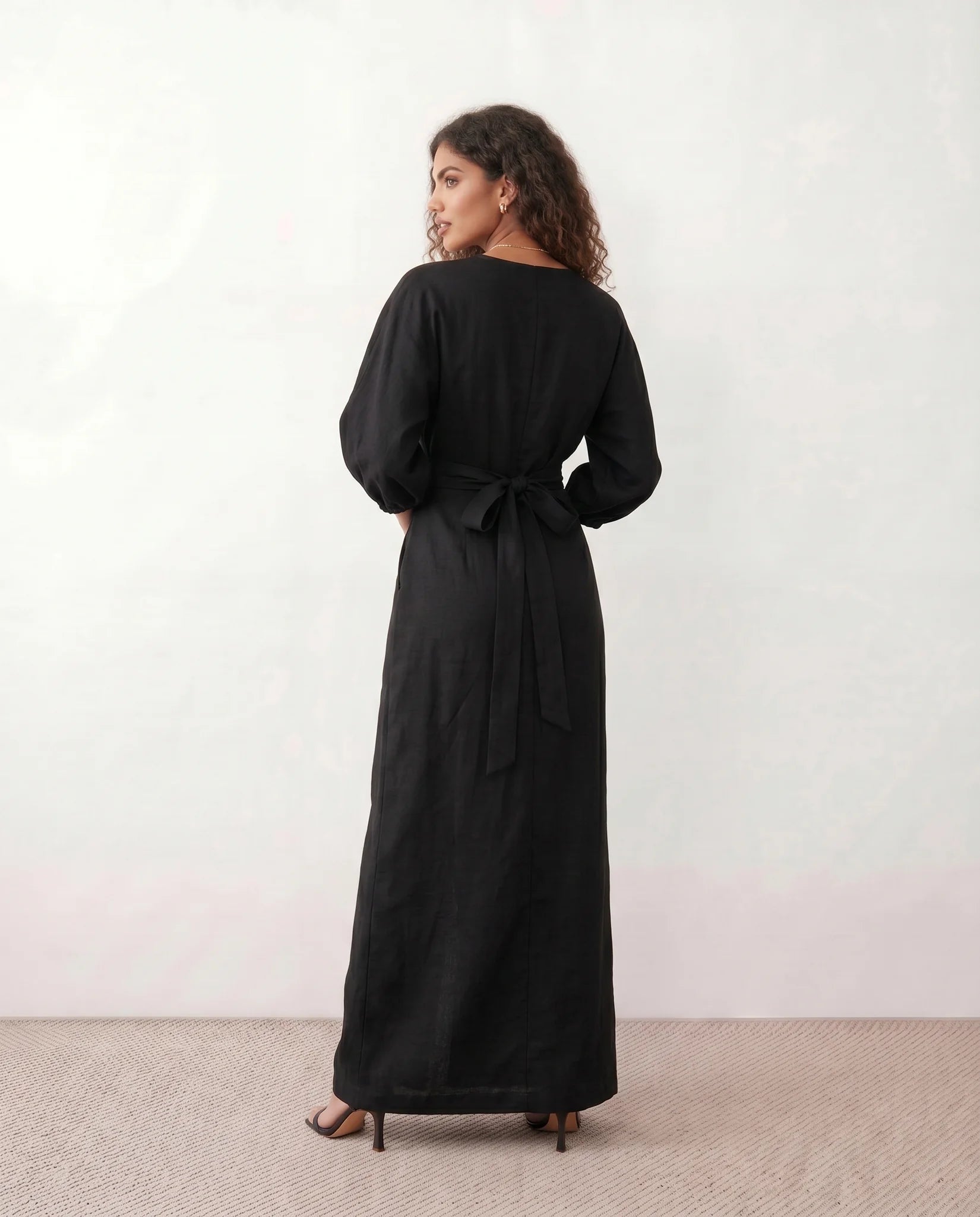 Nelida Wedding Guest Wrap Neck Maxi Dress in Black — back view