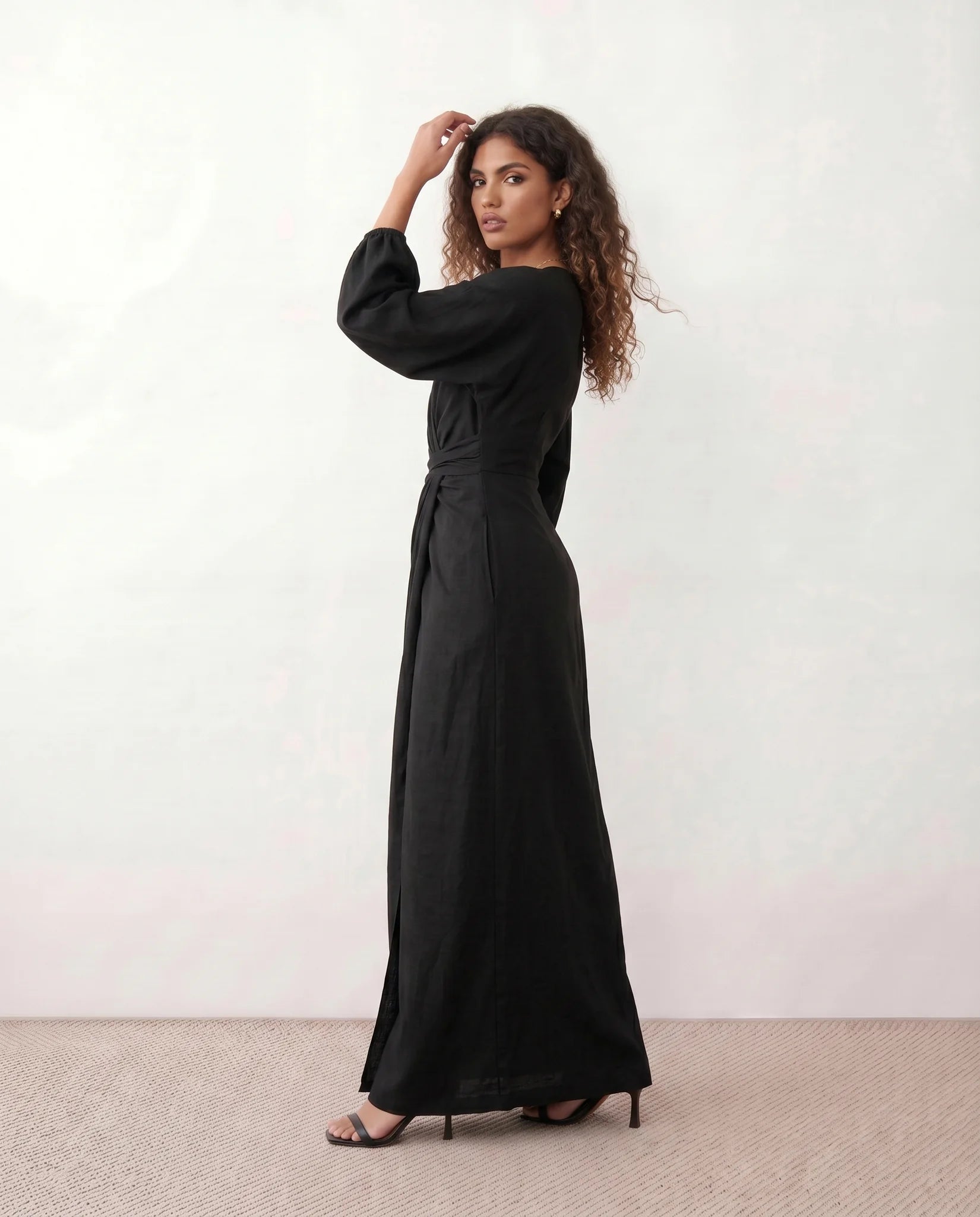 Nelida Wedding Guest Wrap Neck Maxi Dress in Black — side view