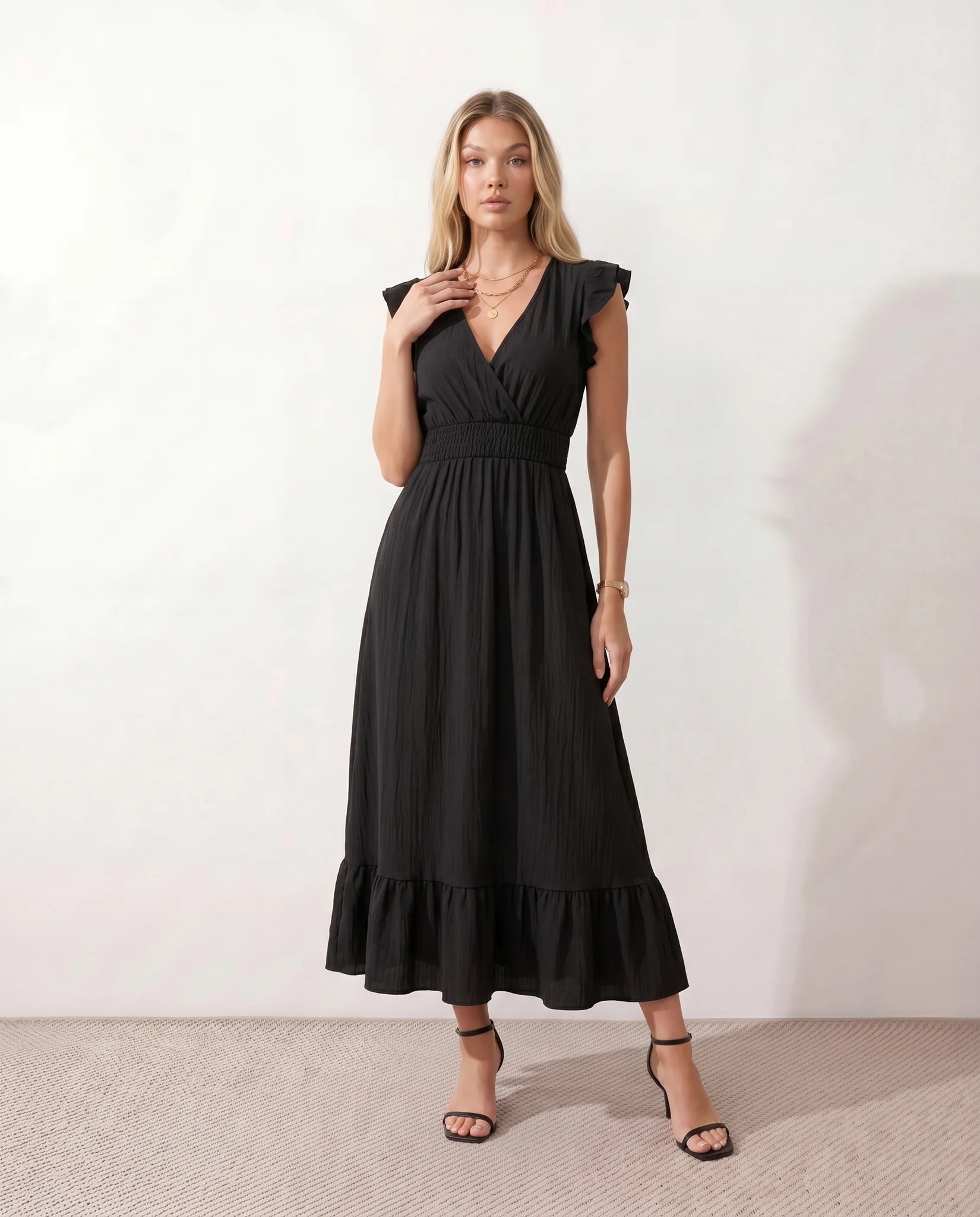 Mirtha Low Back Ruffle Detail Midi Dress in Black — front view