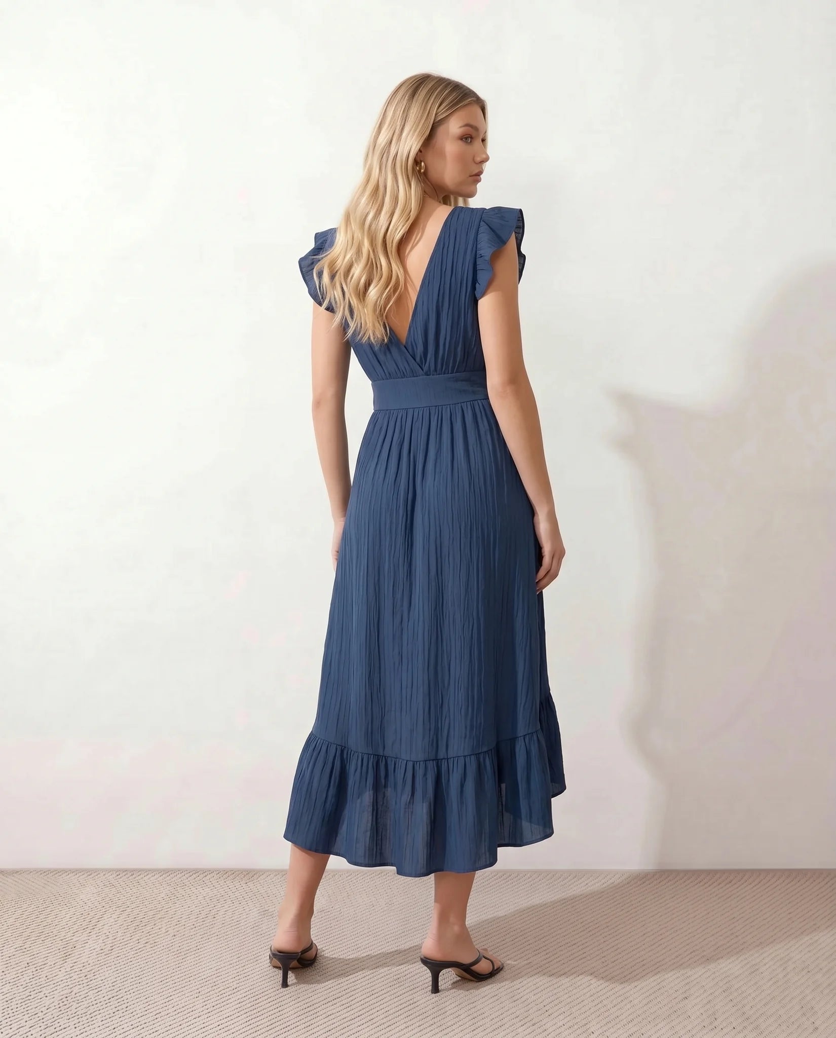 Mirtha Low Back Ruffle Detail Midi Dress in Navy — back view