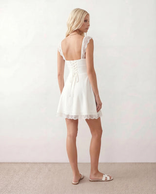 Soraia Lace Lace-Up Mini Dress in White — back view