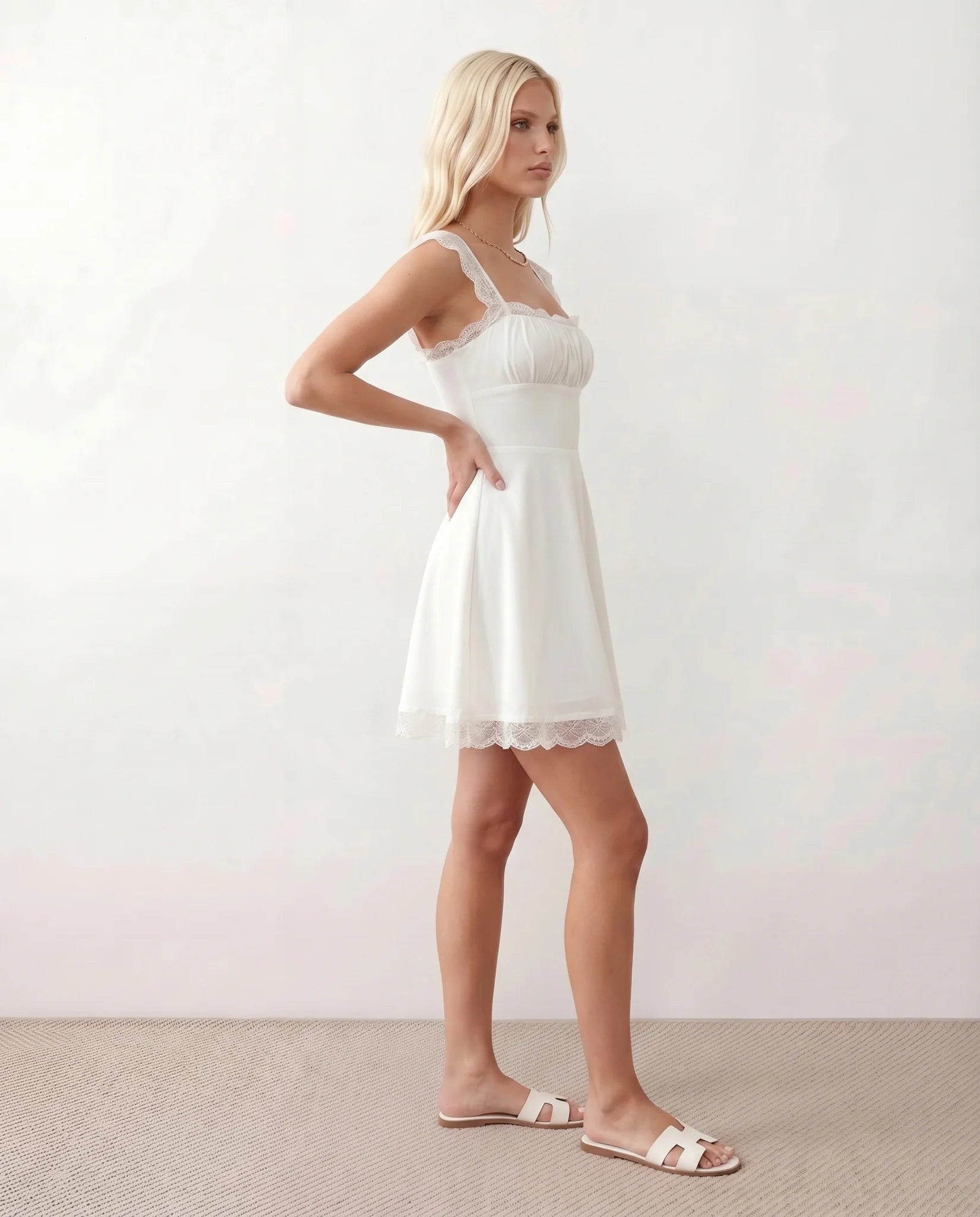Soraia Lace Lace-Up Mini Dress in White — side view