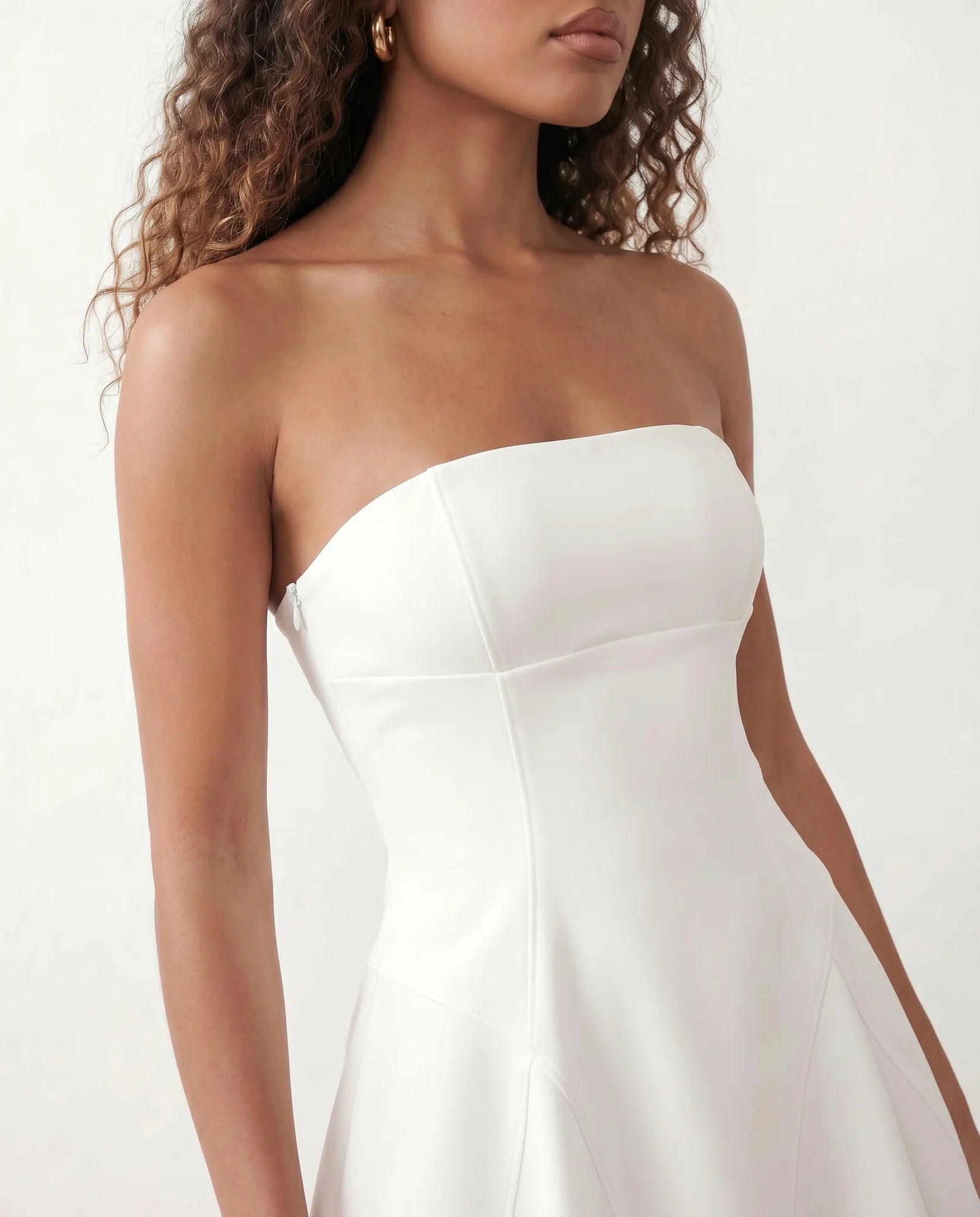 Camilla Strapless Pleated Mini Dress in White — detail close-up