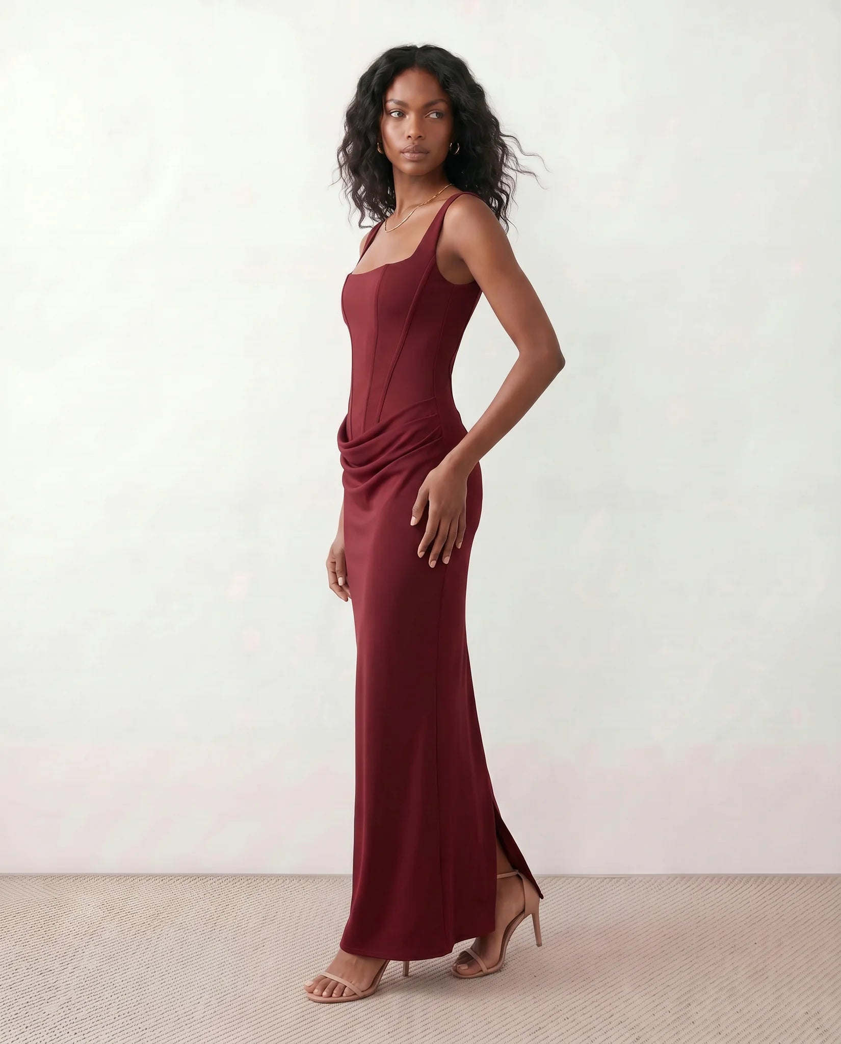 Justina Basque Waist Fitted Maxi Dress in Burgundy — side view