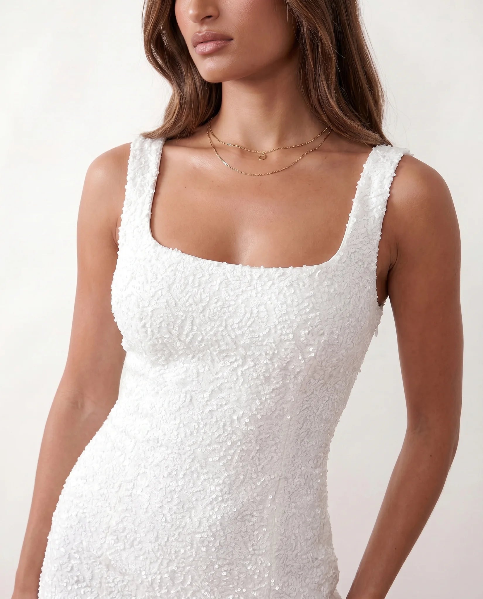 Elodie Sequined Low Back Mini Dress in White — detail close-up
