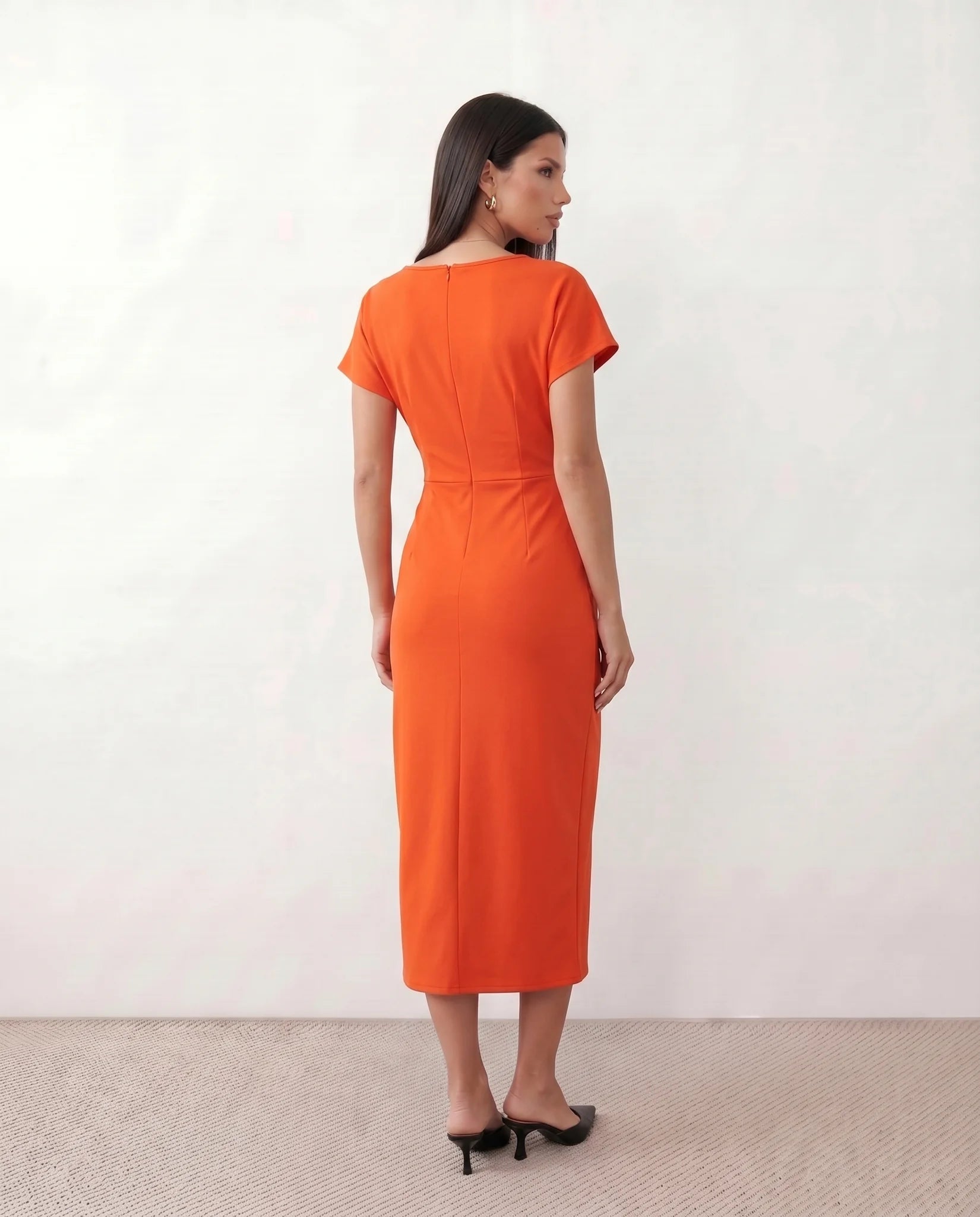 Eugenia Draped Midi Dress in Orange — back view