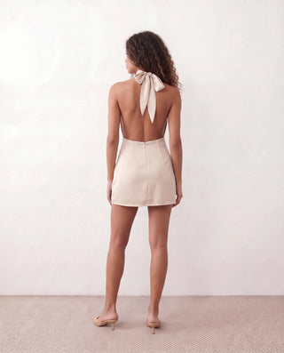 Piia Glossy Halter Mini Dress in Beige — back view