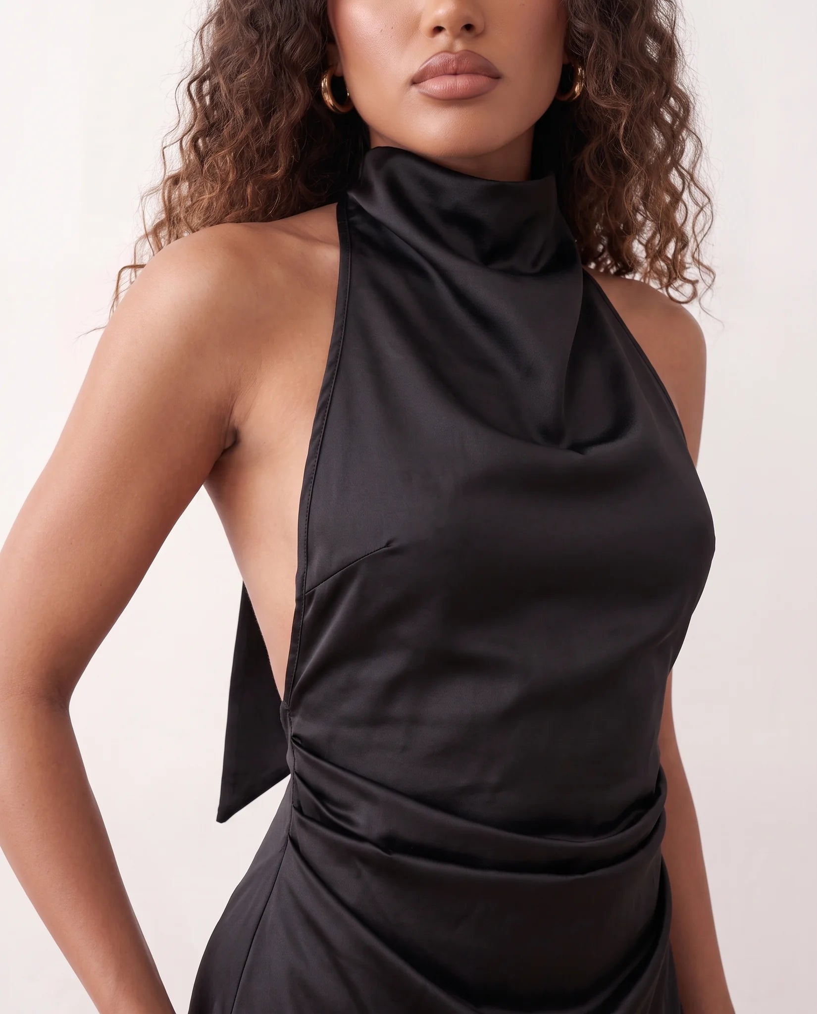 Piia Glossy Halter Mini Dress in Black — detail close-up