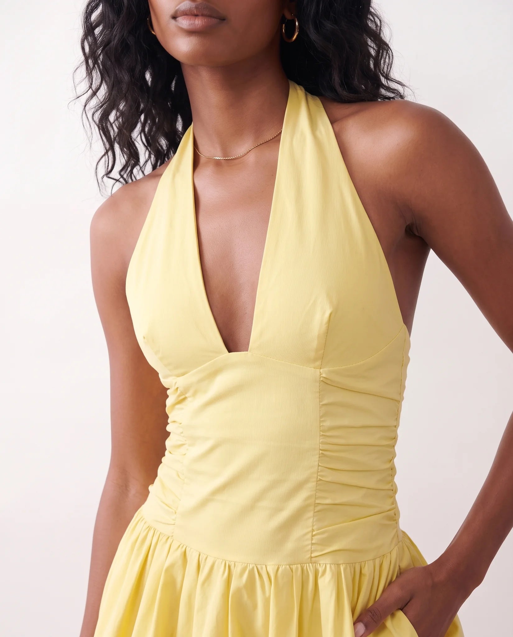 Ivana Halter Plunge Neck Mini Dress in yellow — detail close-up