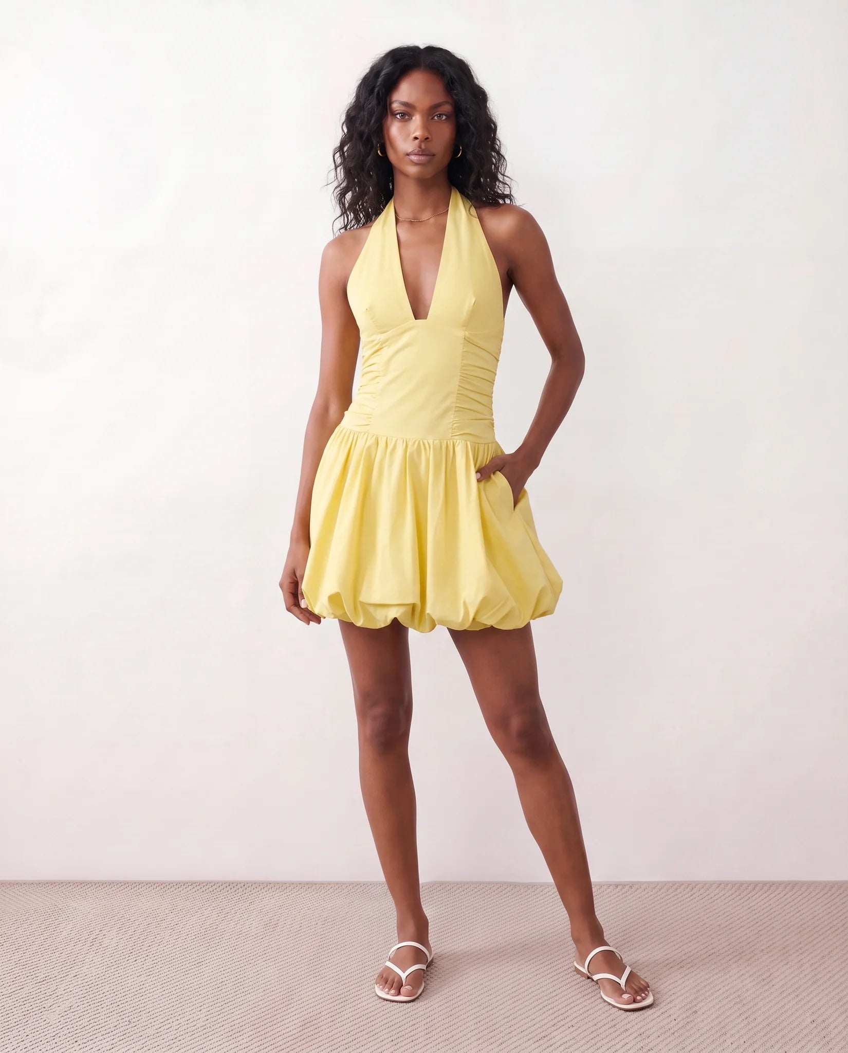 Ivana Halter Plunge Neck Mini Dress in yellow — front view