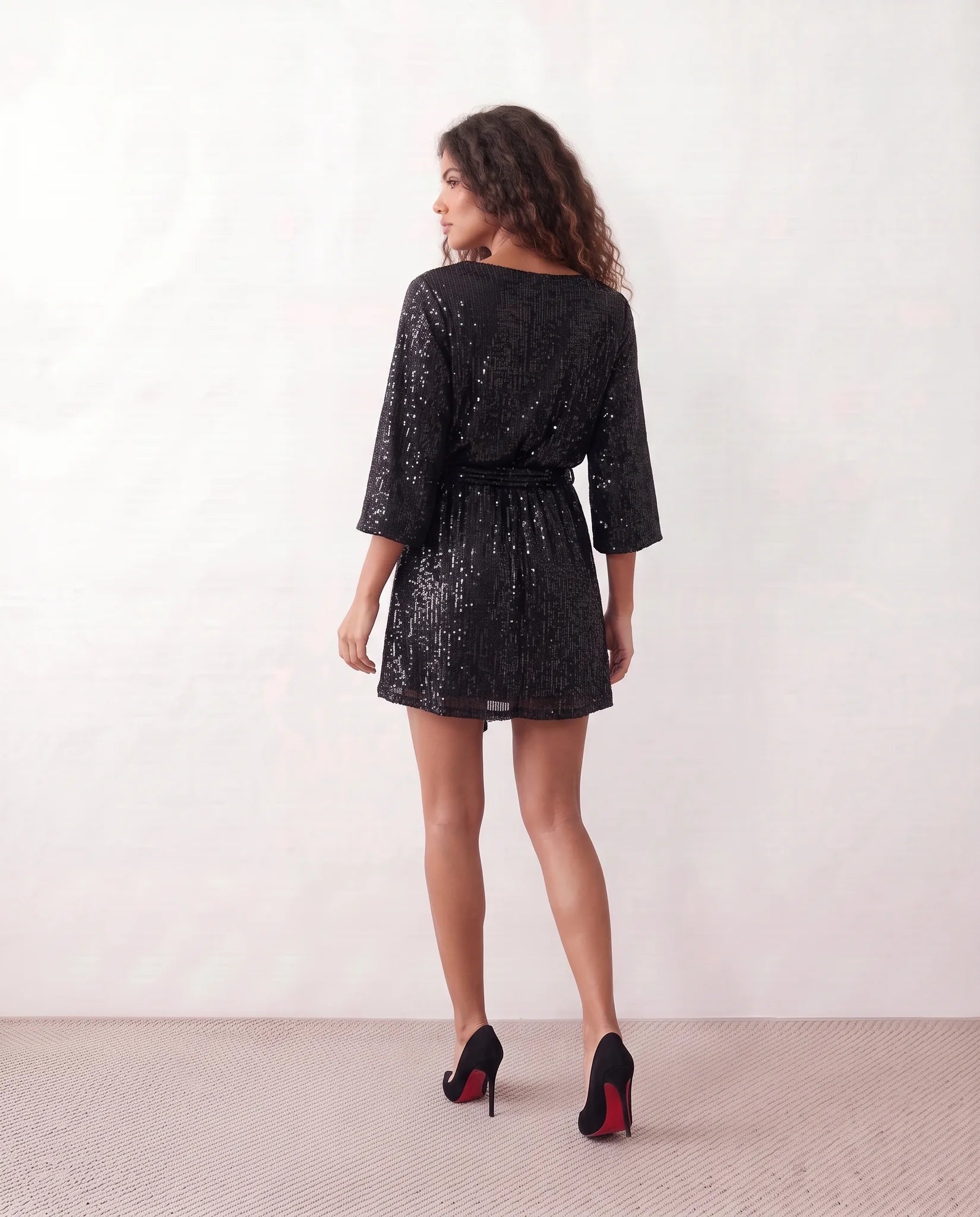 Yaritza Sequined Belted Mini Dress in Black — back view